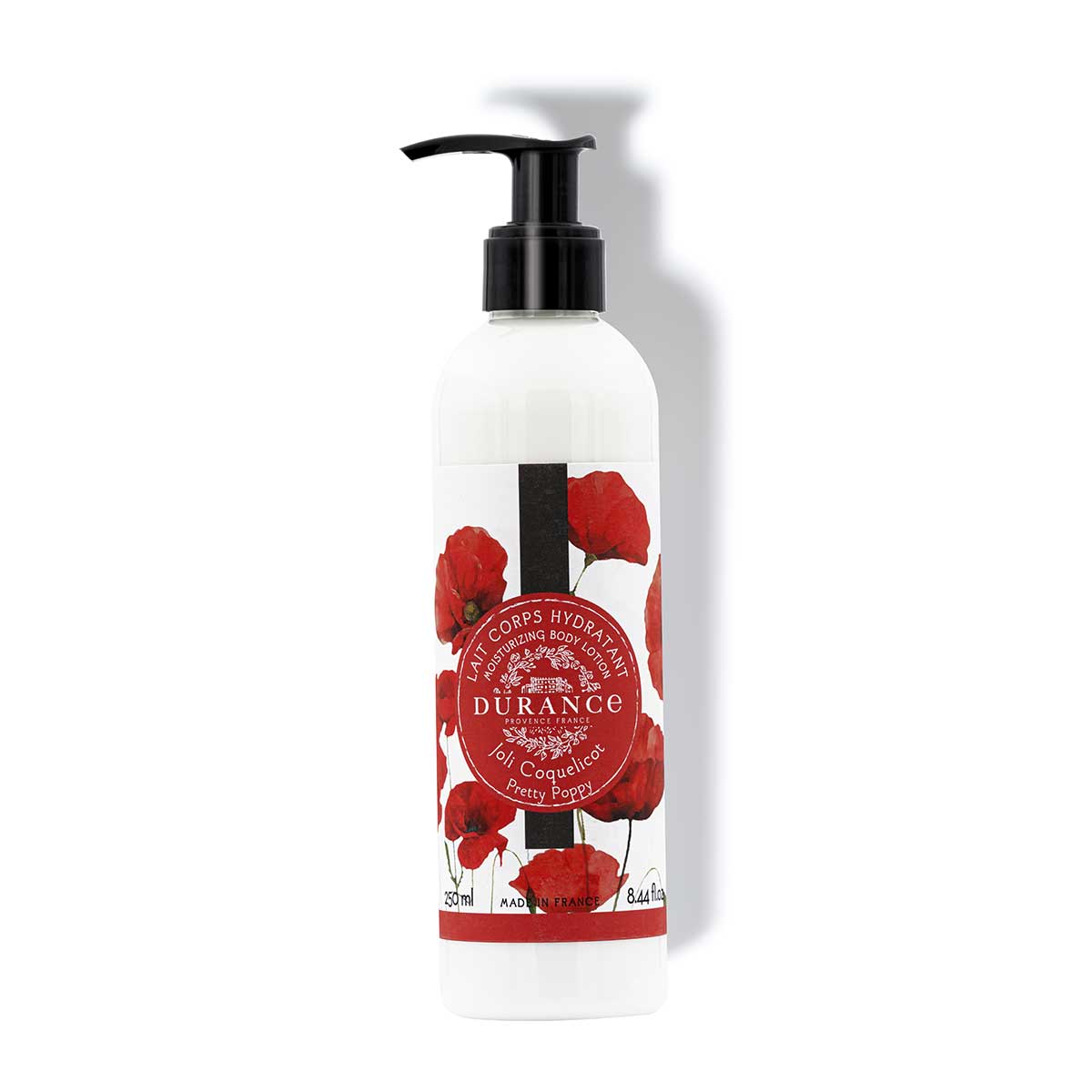 250ml koerperlotion mohnbluete in einer kunststoffflasche mit pumpfunktion vor einer weissen wand