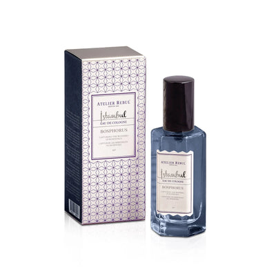 istanbul bosporus cologne in blauem flaeschchen mit schwarzer kappe. weisser hintergrund.