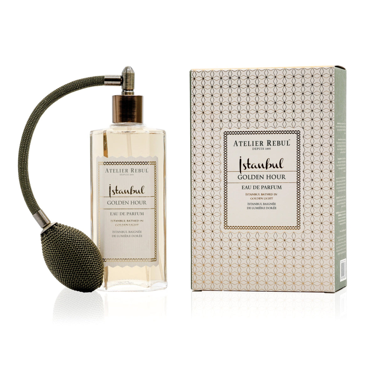 Atelier Rebul Istanbul Golden Hour Eau de Parfum 125 ml im Glasflakon mit olivgrünem Ballzerstäuber neben gemusterter Verpackung auf weißem Hintergrund.
