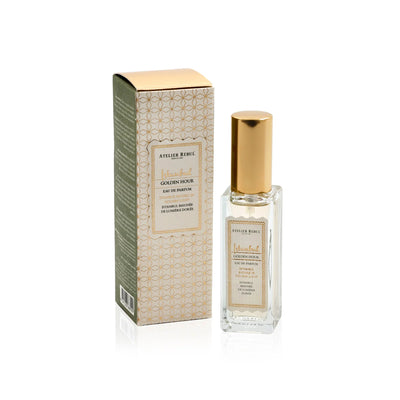 Istanbul Golden Hour Eau de Parfum 12 ml mit goldener Kappe neben der gemusterten Verpackung vor weißem Hintergrund.